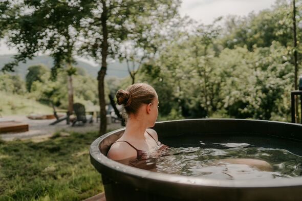 Woman using a cold plunge tub