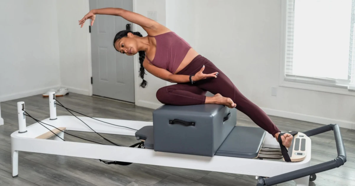 Woman using a pilates machine