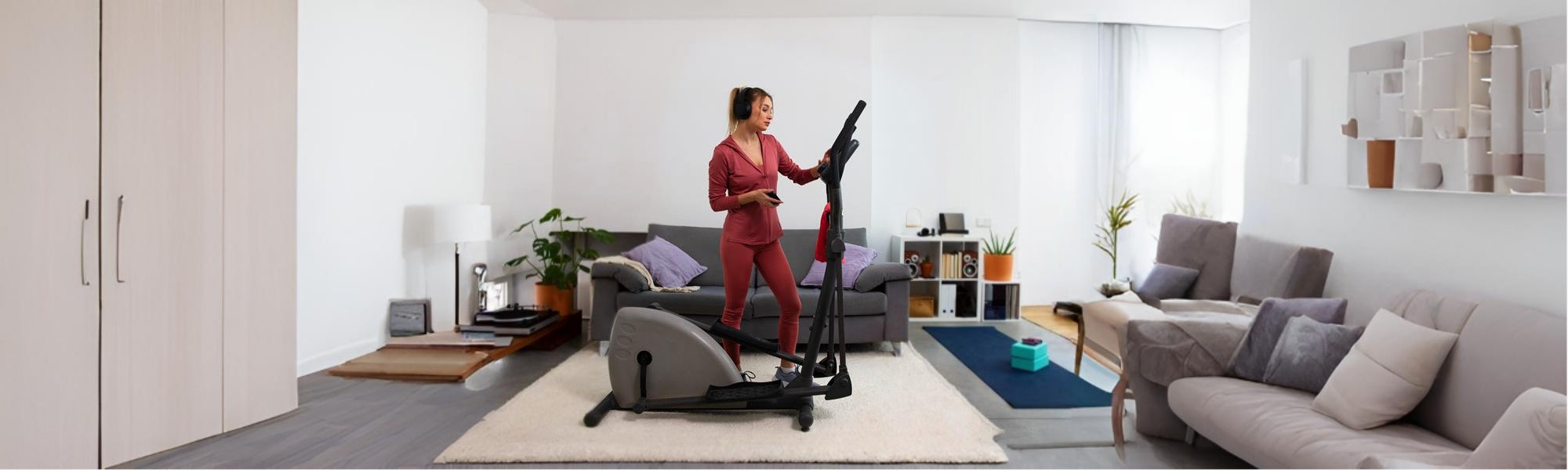 Person using an elliptical in home gym