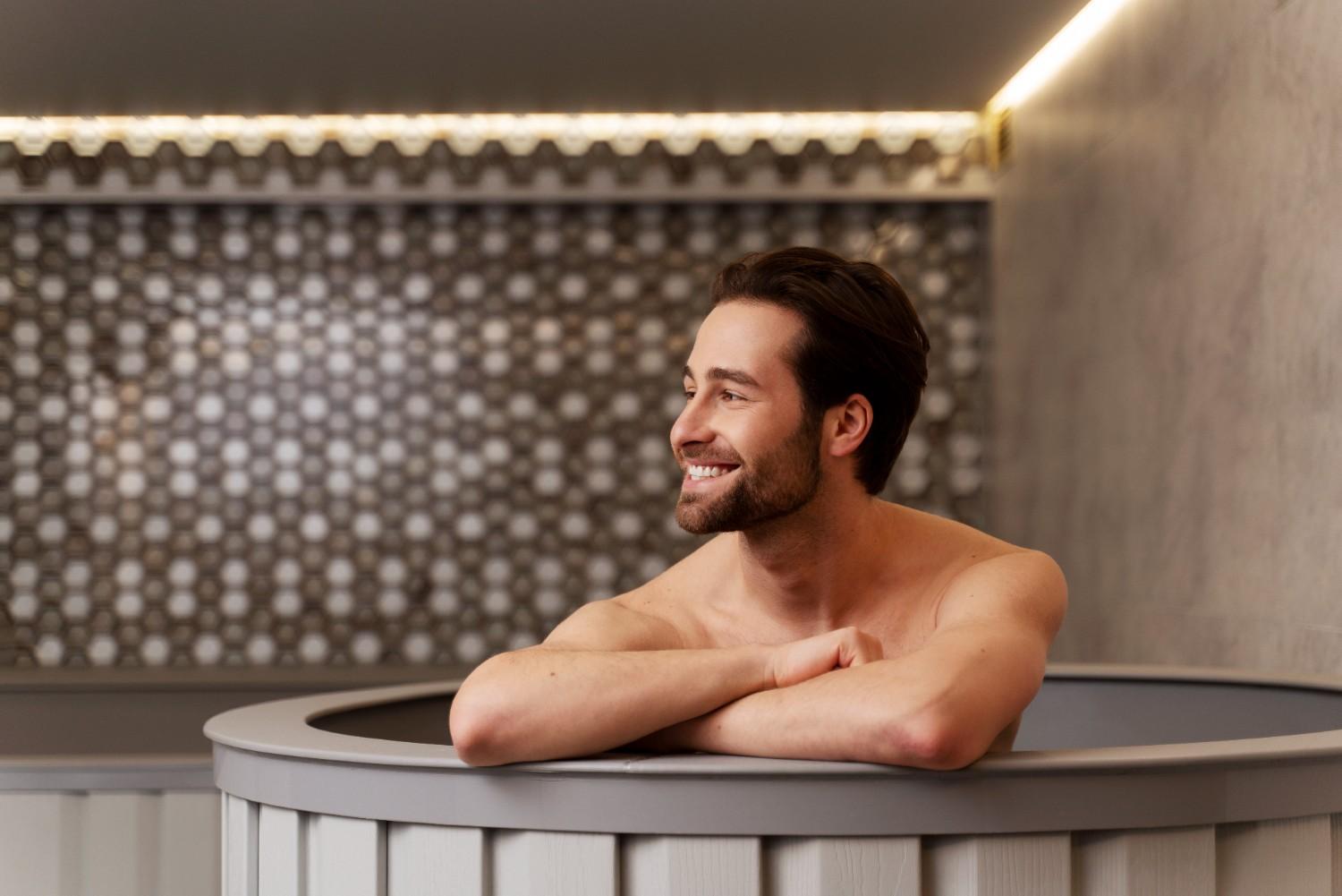 Man in a cold plunge tub