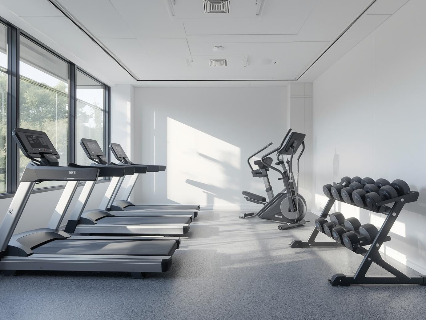 office gym with elliptical, weights, treadmills