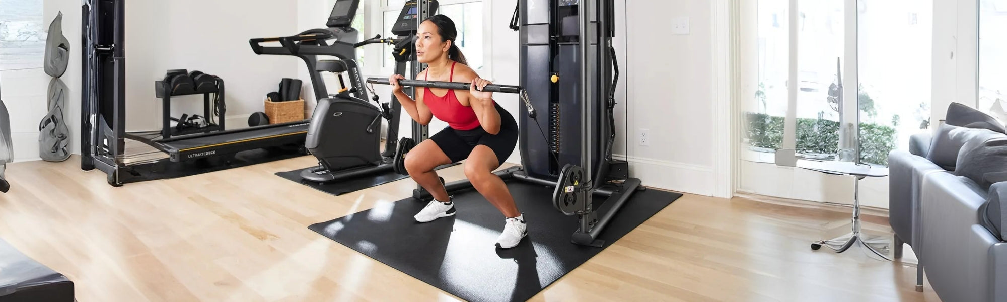 Woman using a strength machine