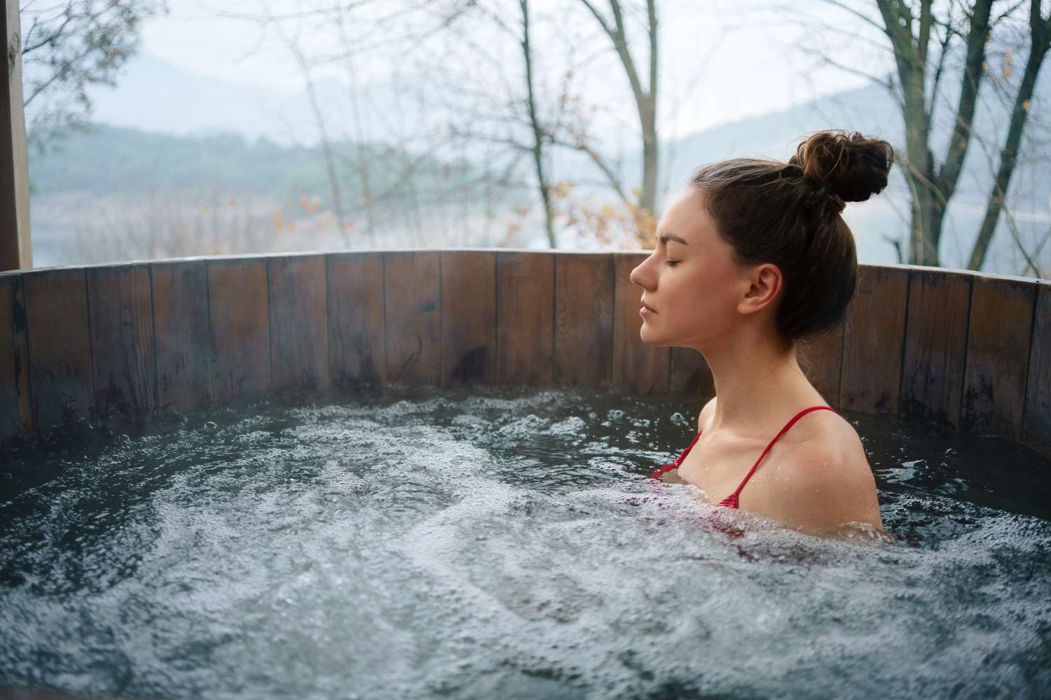 Woman using cold plunge tub
