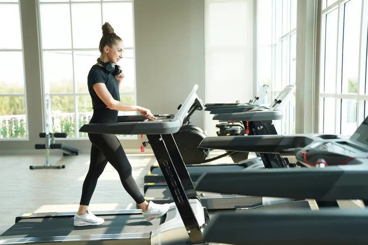 Woman walking on a treadmill