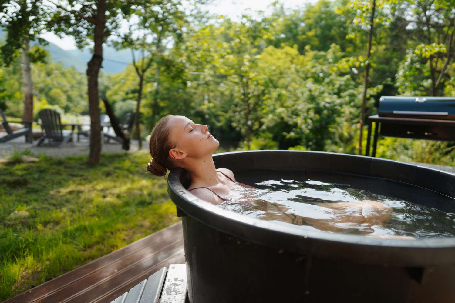 Woman using a cold plunge tub