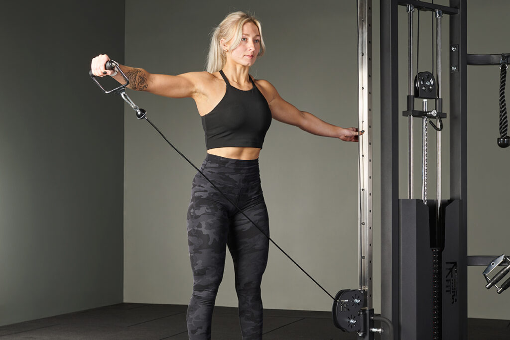 Woman using a functional trainer