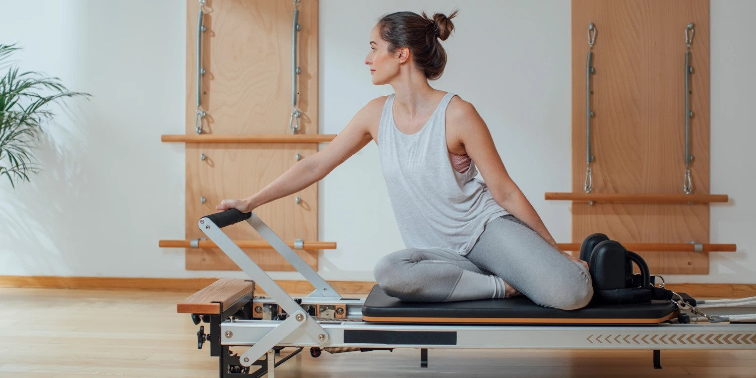 Woman using Pilates Reformer