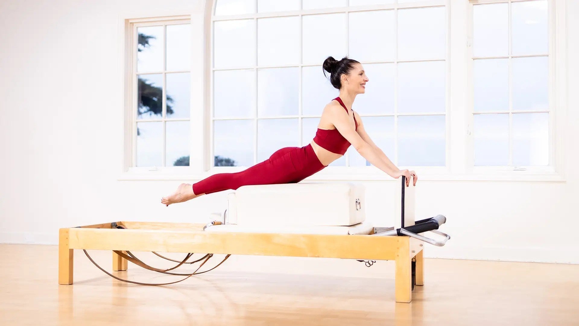 Woman using a pilates machine
